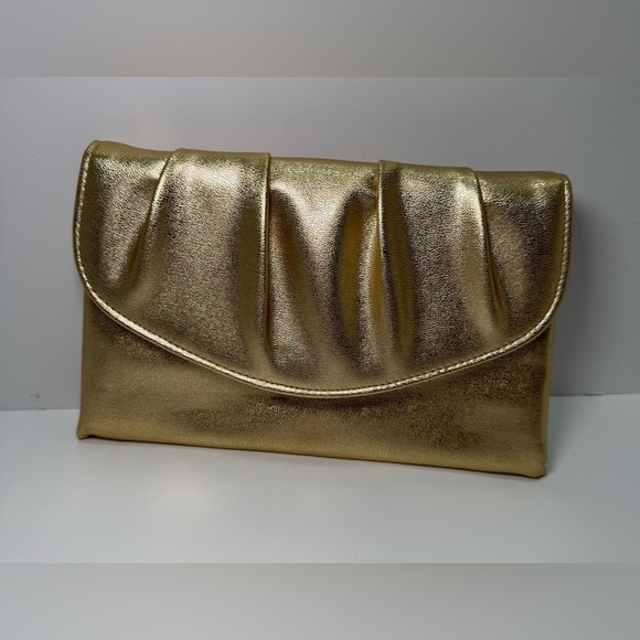 Avon Handbags - Vintage 1978 Avon Polished Gold Metallic clutch